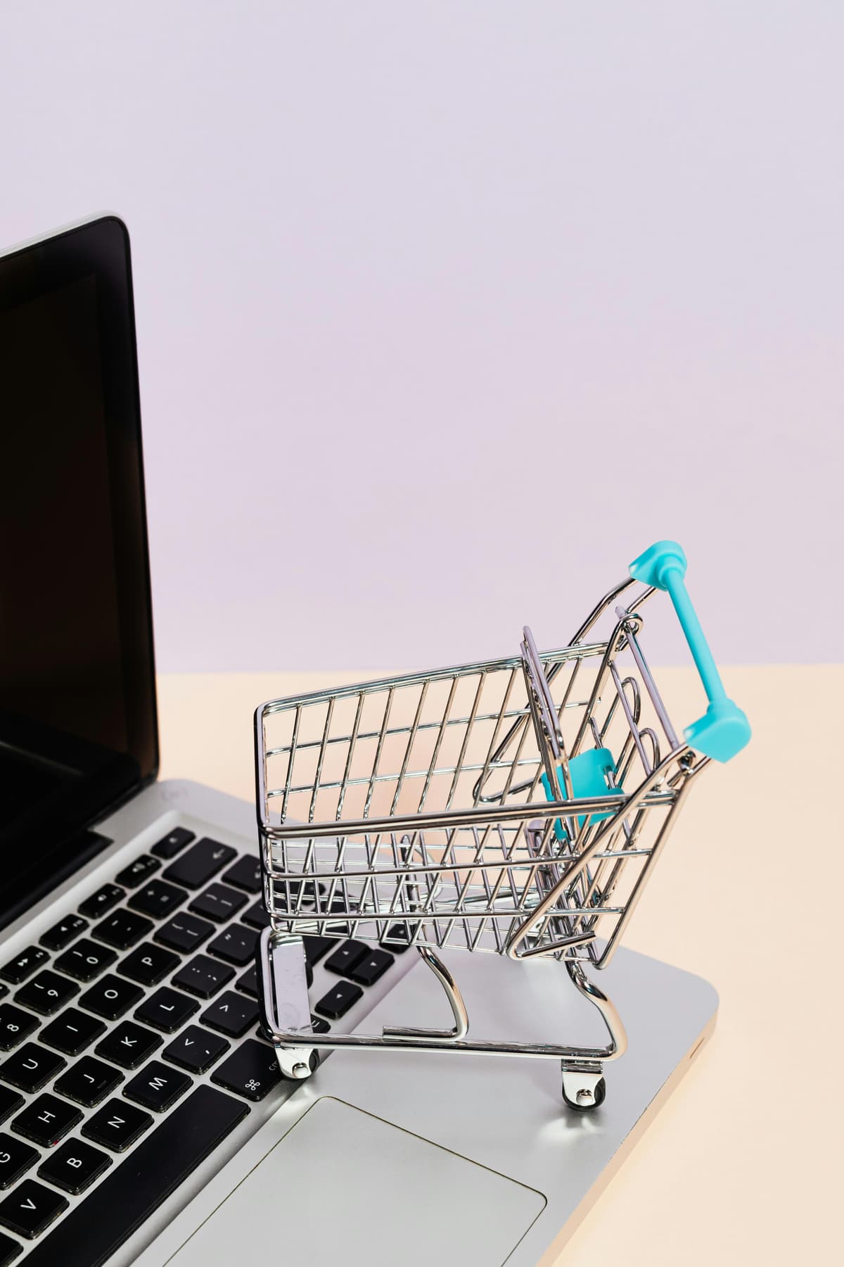 A computer with a small shopping basket
